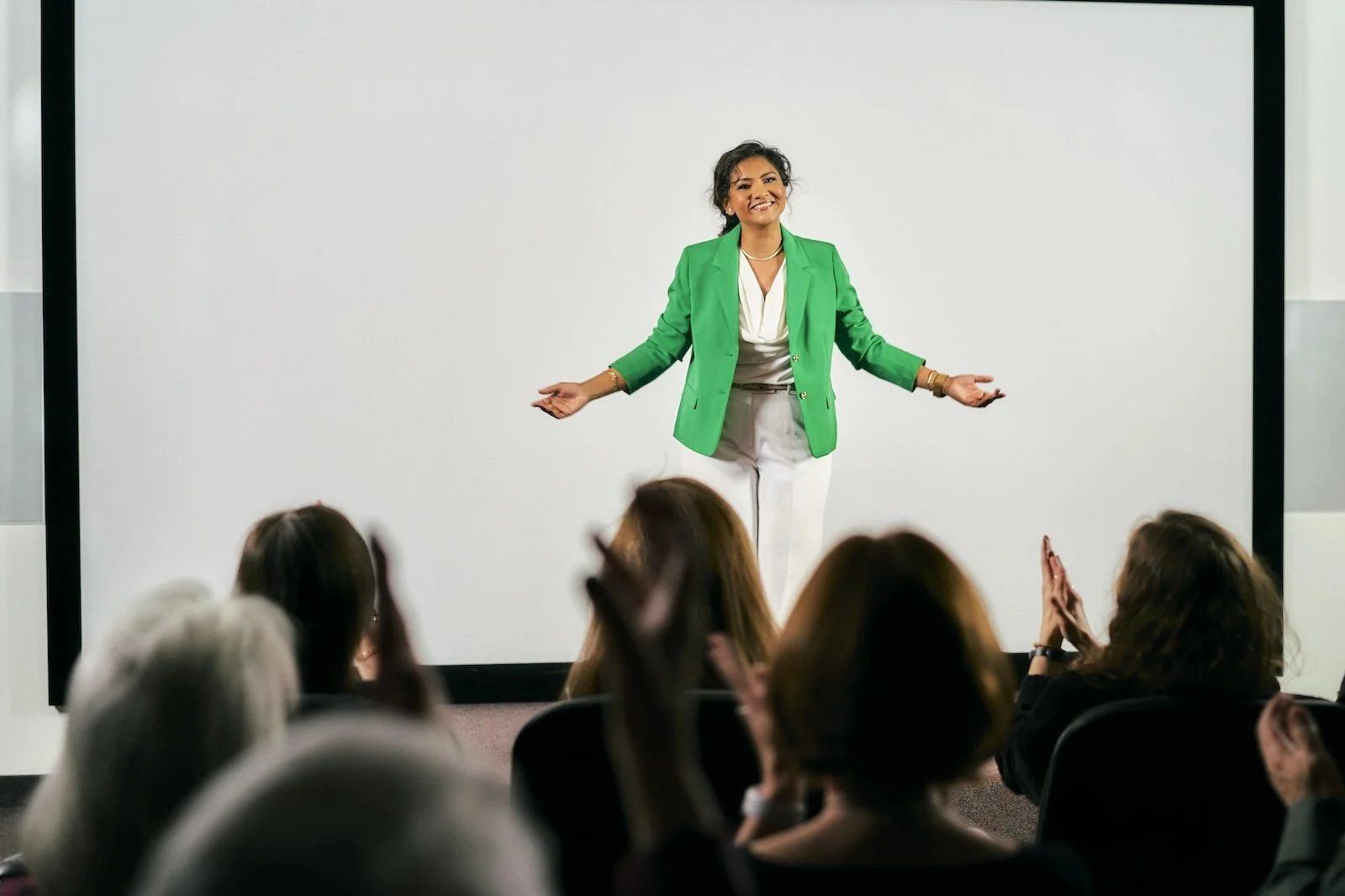 A speaker on stage addressing an audience, photographed by Series A Photography in New York City